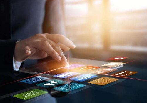 Hands of woman trader using tablet computer in blurry city with double exposure of digital graphs. Concept of stock exchange and market analysis. Toned image